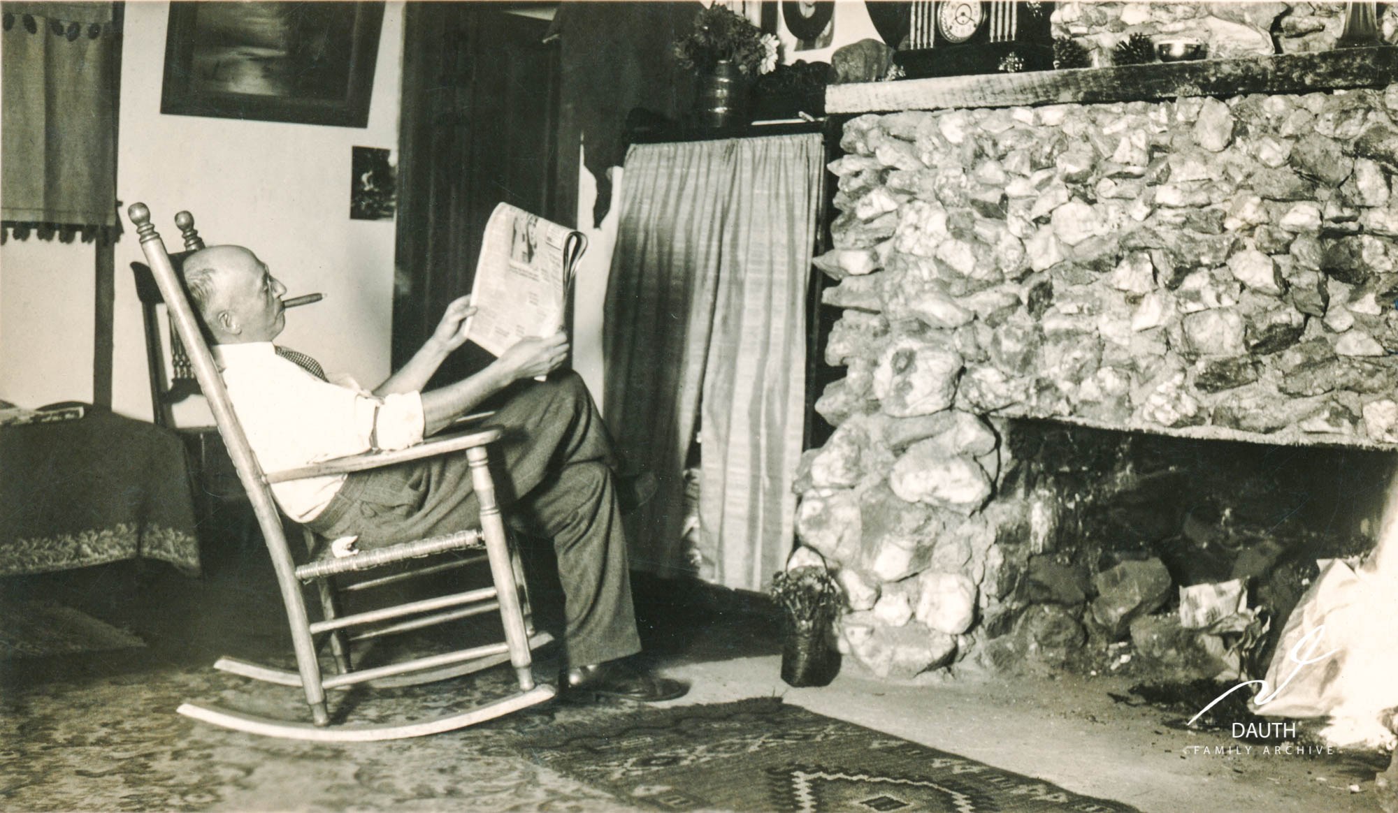 Idlewild Lodge - idlewildlodge.github.io - Circa 1930s - George Dauth sitting in front of the hearth of Idlewi